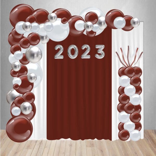 Graduation Custom Decor Package 5 includes a curtain backdrop, organic balloon arch, balloon column, and 4-3' mylar balloons.