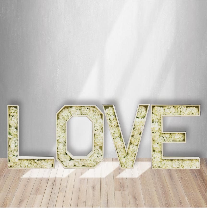 Our beautiful LOVE Marquee letters filled with off-white flowers are a beautiful addition to your wedding or shower.